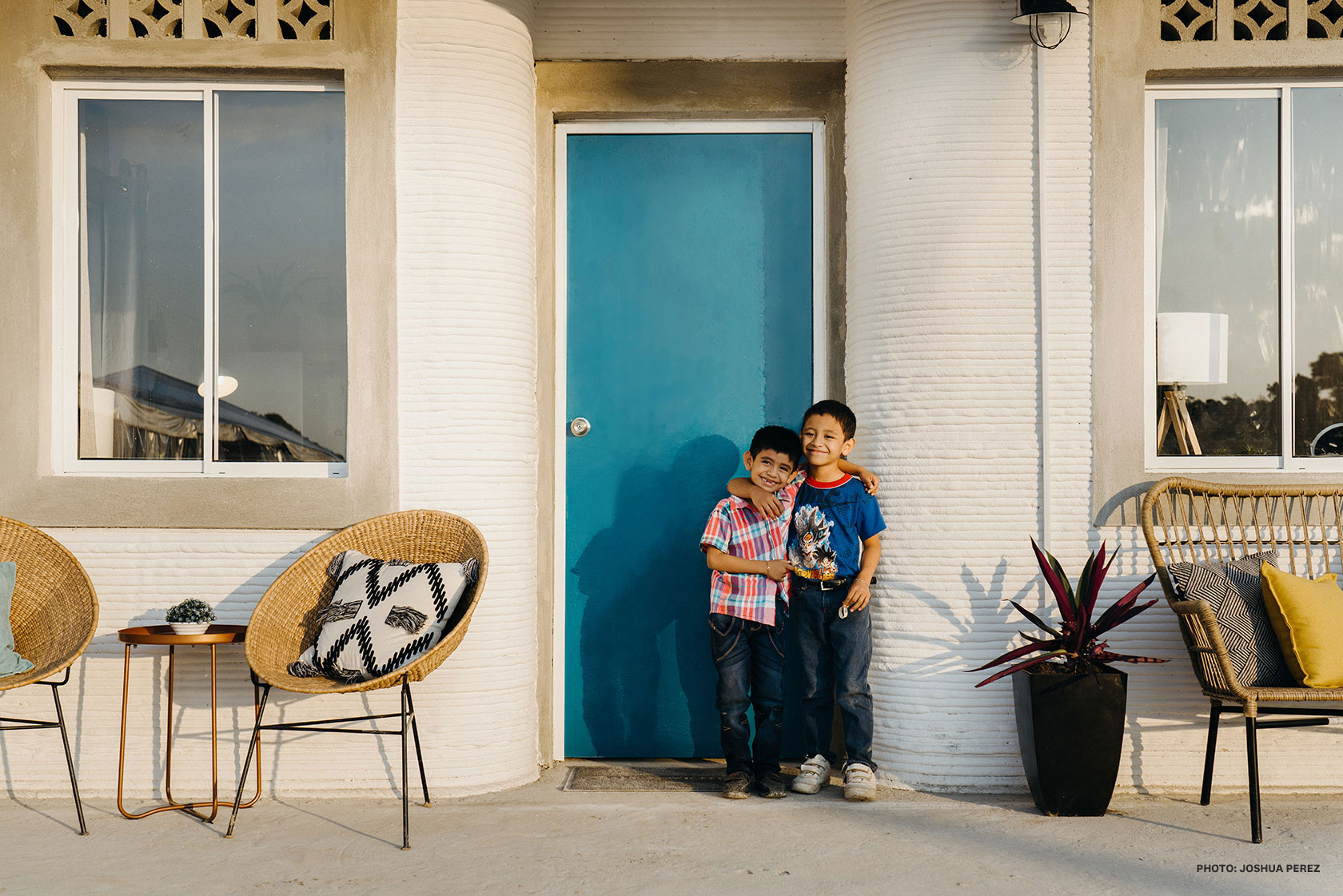 two children on the porch of a home printed by the vulcan 2