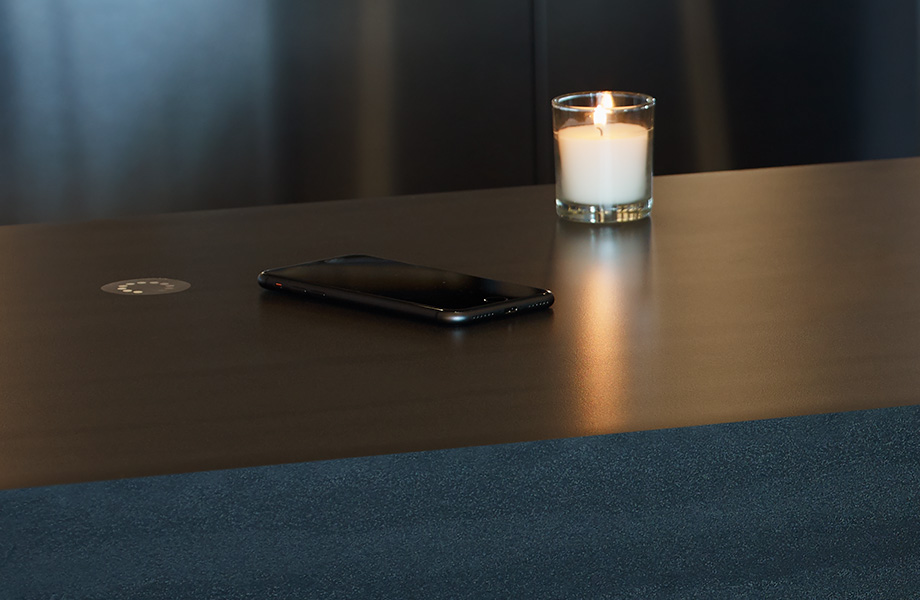 phone and candle on a table