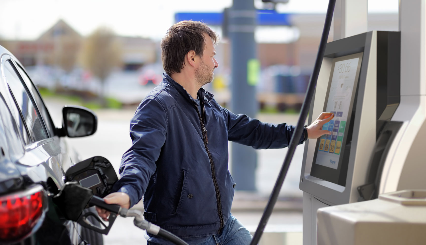 man fueling a vehicle