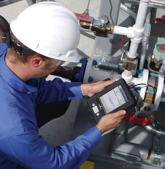 technician using an emerson trex communicator