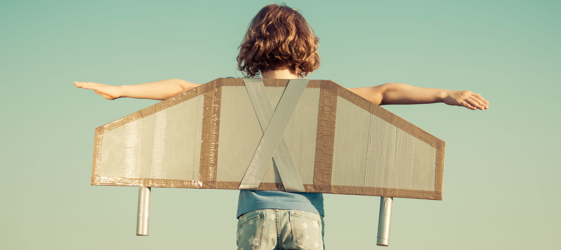 a child with cardboard wings