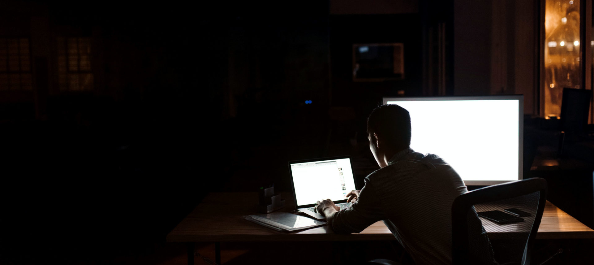 designer working alone in the dark