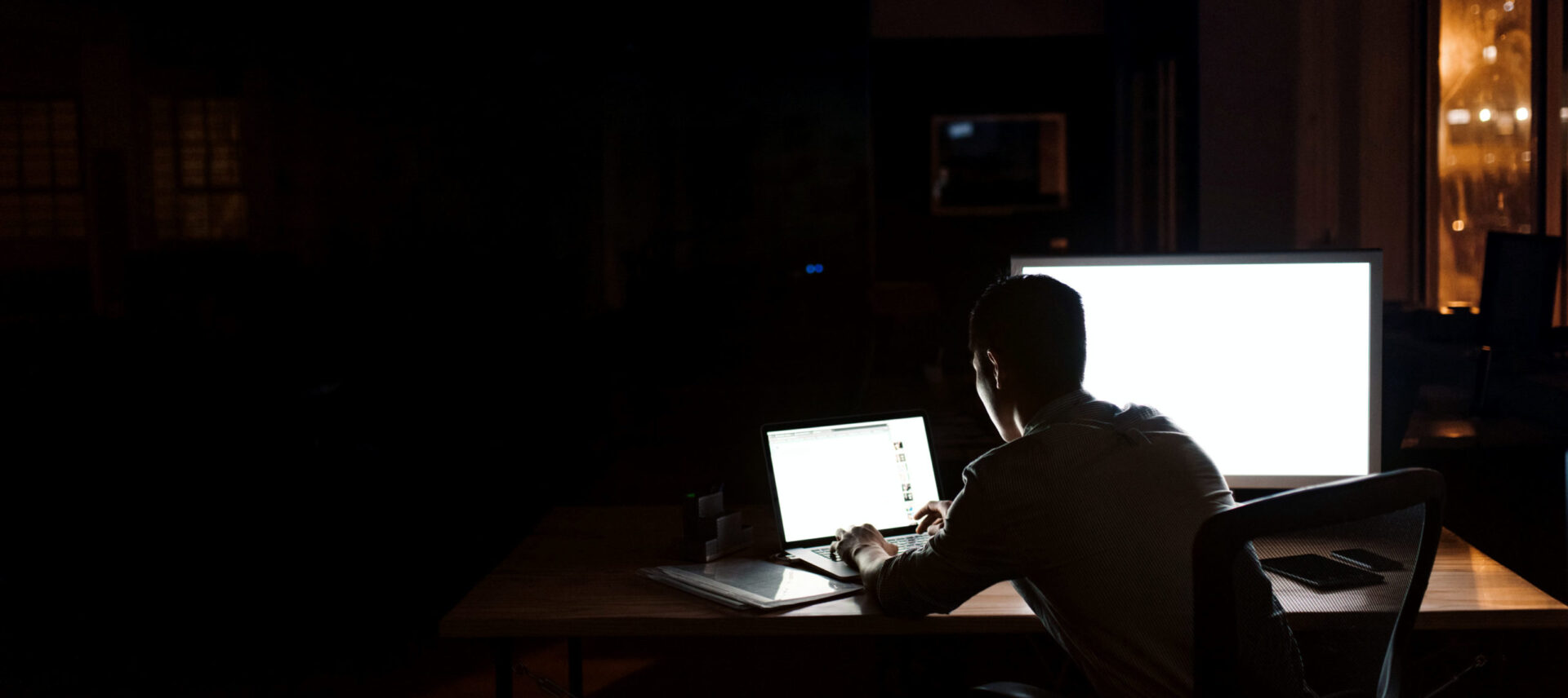 designer working alone in the dark