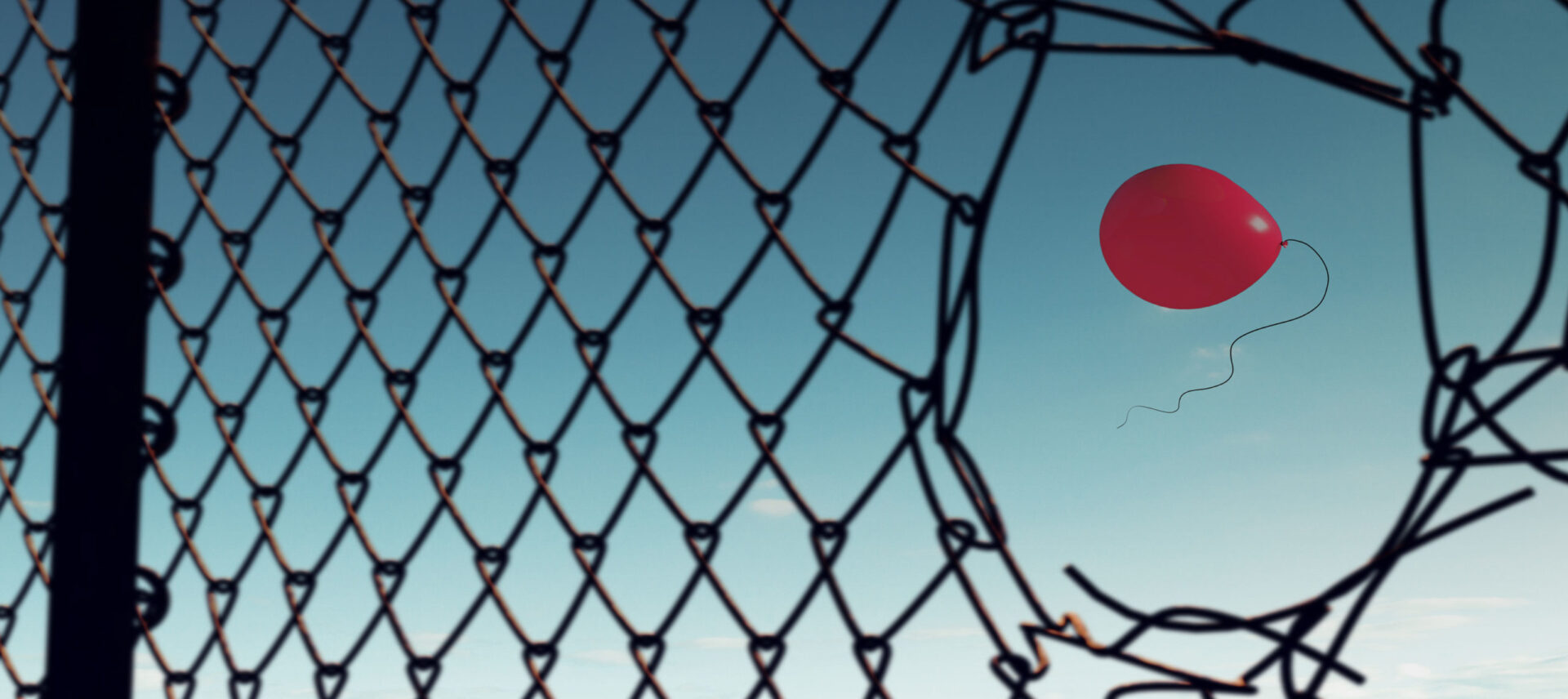 balloon escaping through a net