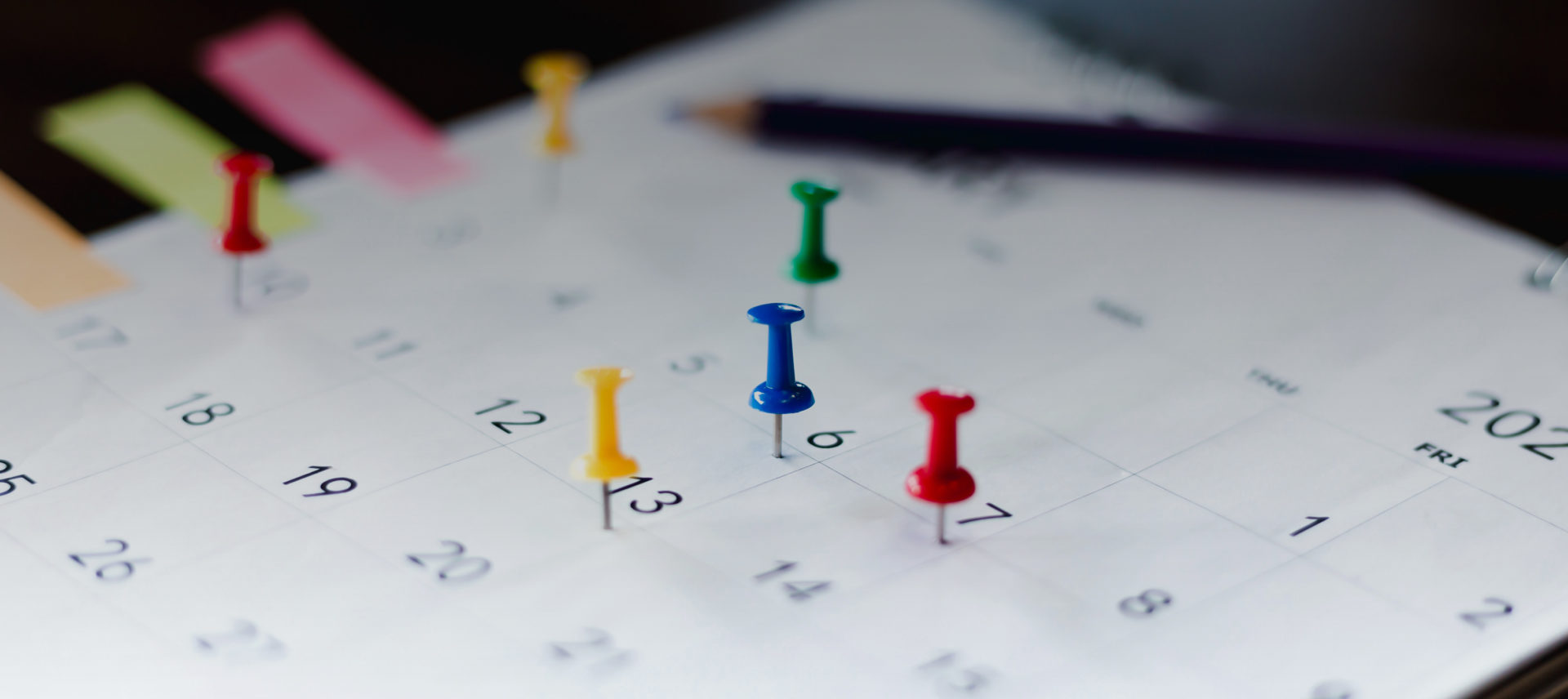 push pins on a calendar